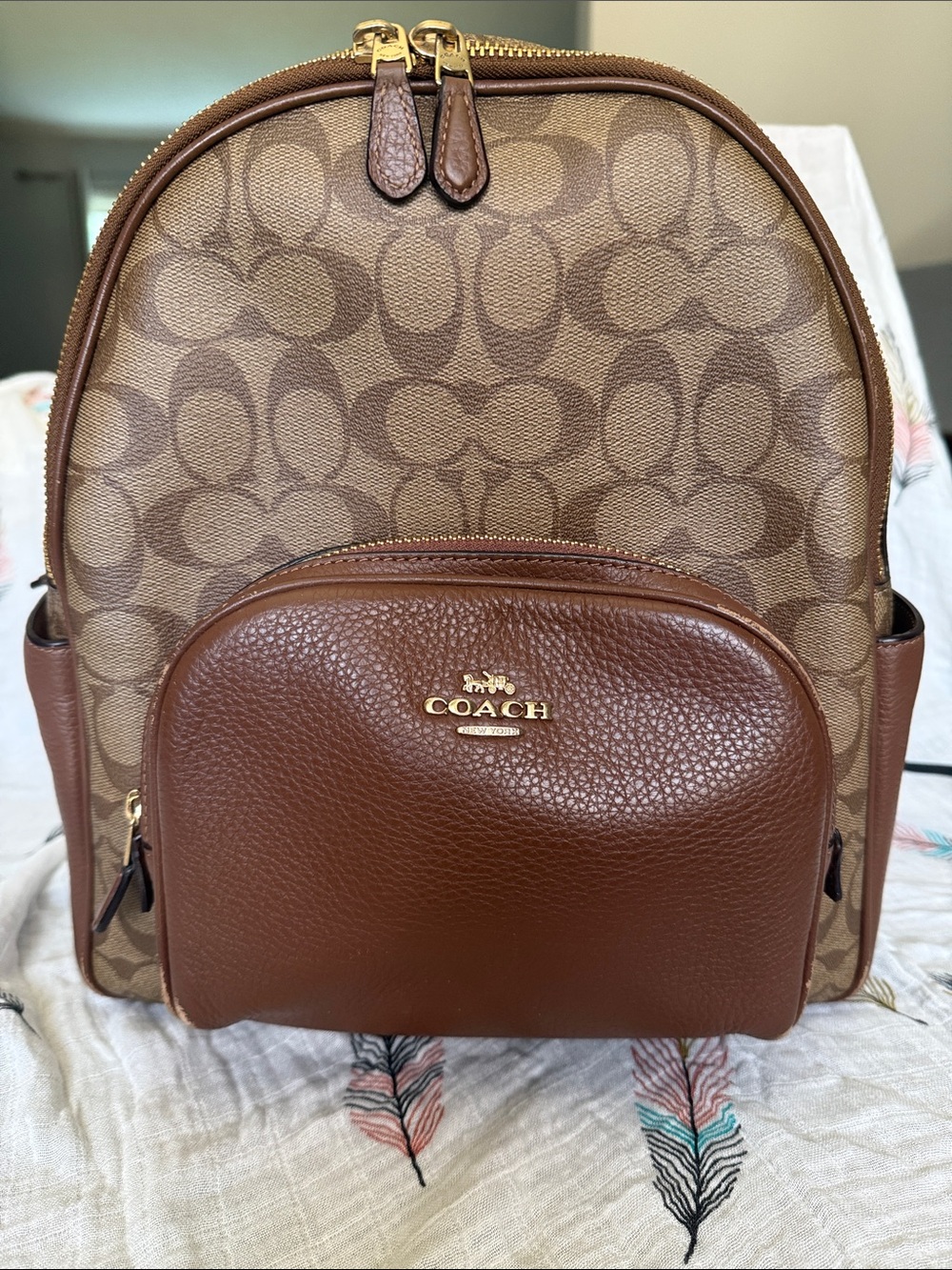 Coach Brown Signature Leather Backpack with gold hardware